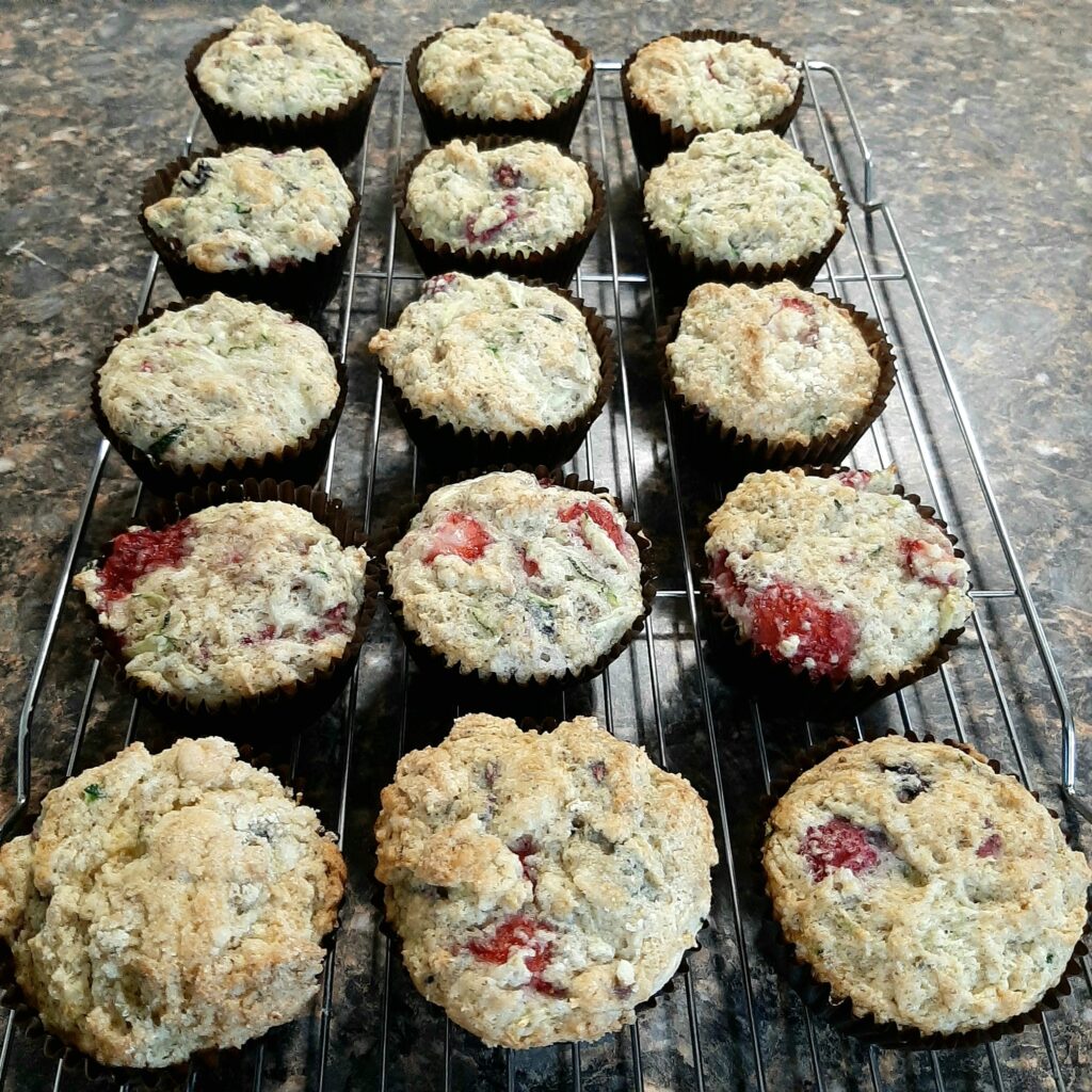 Picture of 15 muffins cooling on a rack